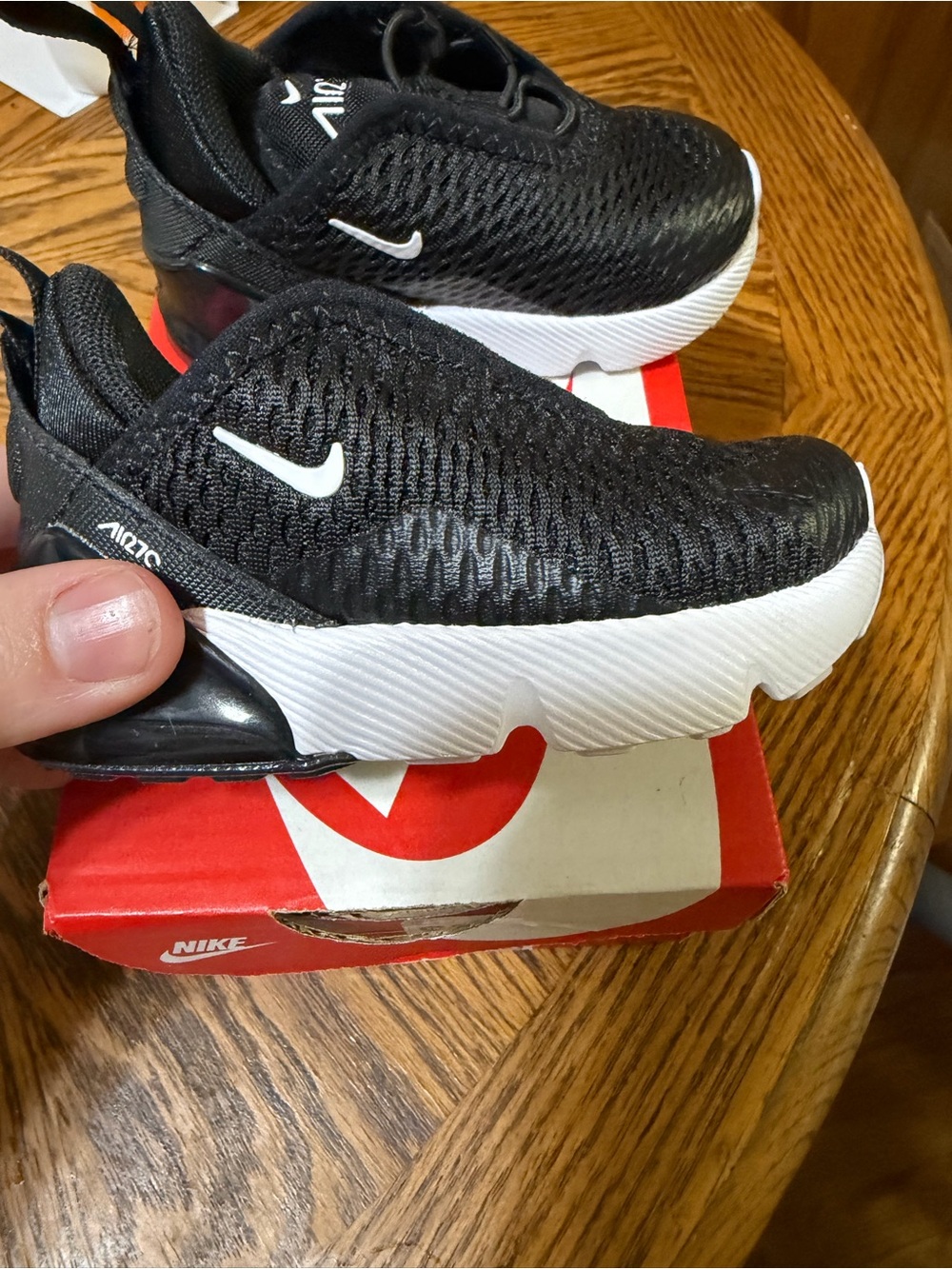 Nike Kids Black and White Slip-On Mesh Sneaker with Red Heel Accent